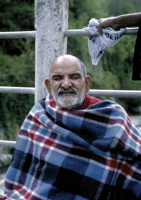 Shri Neem Karoli Baba Maharaj-ji in plaid blanket